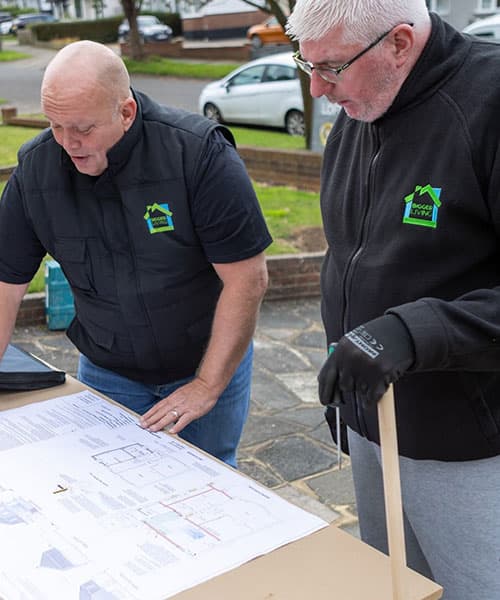 Bigger Living Lofts team reviewing loft conversion plans
